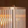 close up image of ribbed glass of pendant light with antique brass metalwork