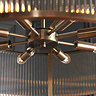 close up image taken from underneath looking up at 8 bulbs in ribbed glass pendant light