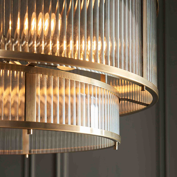 close up image of ribbed glass and antique metalwork of pendant light