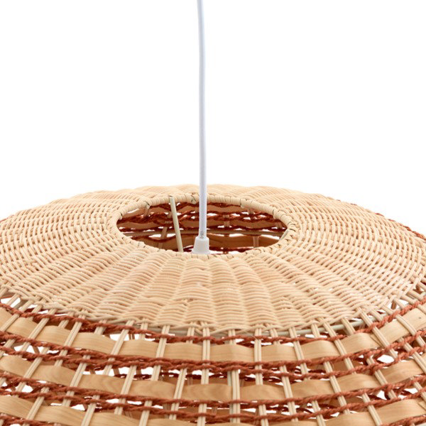 close up image of top of rattan hanging oval light shade, where white cable goes into shade through circle