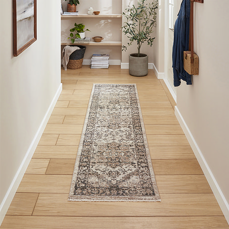 image of vintage green runner on light wood flooring