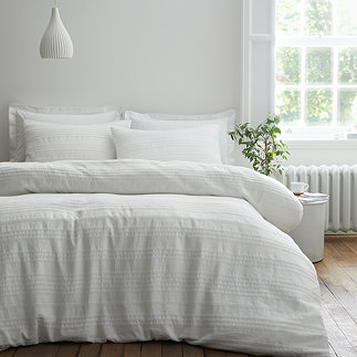 Waffle cotton stripe white on bed image 1