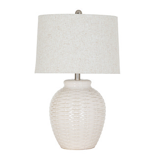 image cut out on white background of white ceramic lamp with basketweave detailing