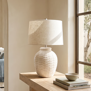 close up on linen shade of ceramic lamp, in an ivory tone