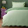 Wiggle in green on bed image 1