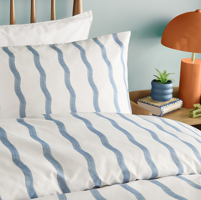 ondula blue duvet cover set close up on bed image 2