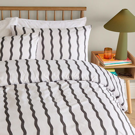 Ondula wave duvet cover on bed image 1