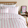 Ondula wave in pink duvet cover on bed image 2