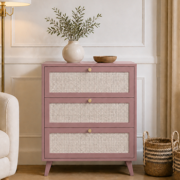 angled image of pink clay three drawer chest with rattan fronts