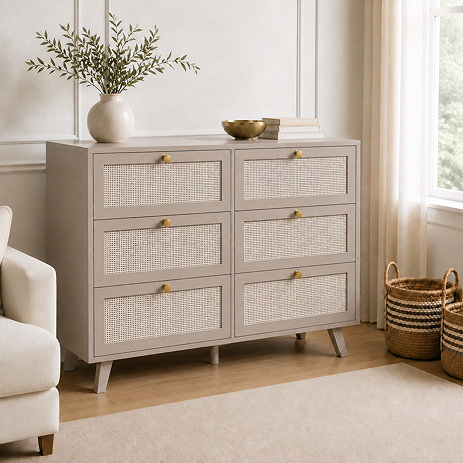 image of soft taupe six drawer chest with rattan front, on wooden flooring of living room