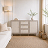 lifestyle image of soft taupe sideboard in living room in front of panelled wall