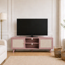 lifestyle image of pink clay coloured tv unit with rattan doors