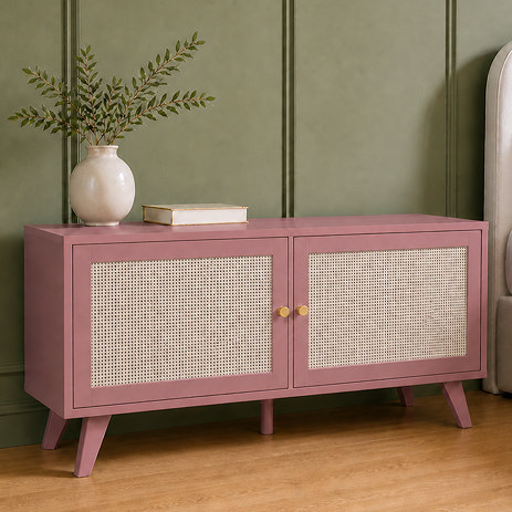 image of clay pink rattan fronted small tv unit in front of green wall