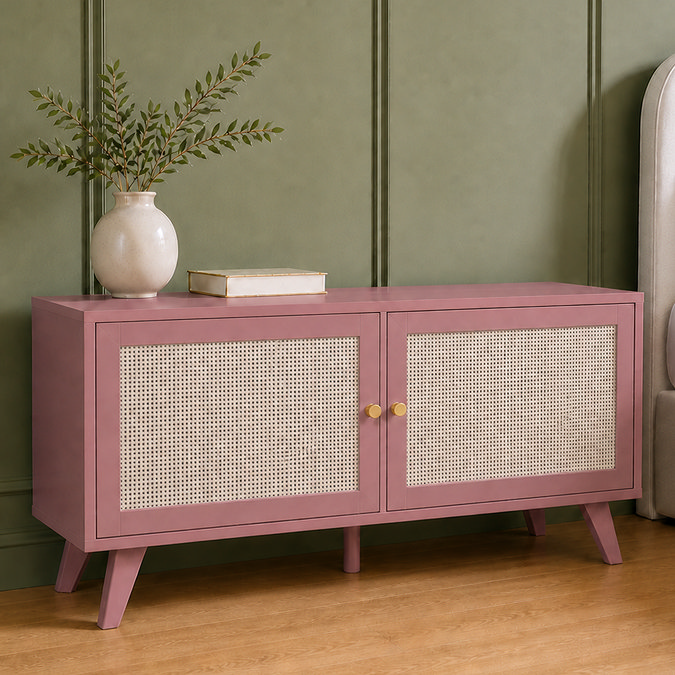 image of clay pink rattan fronted small tv unit in front of green wall