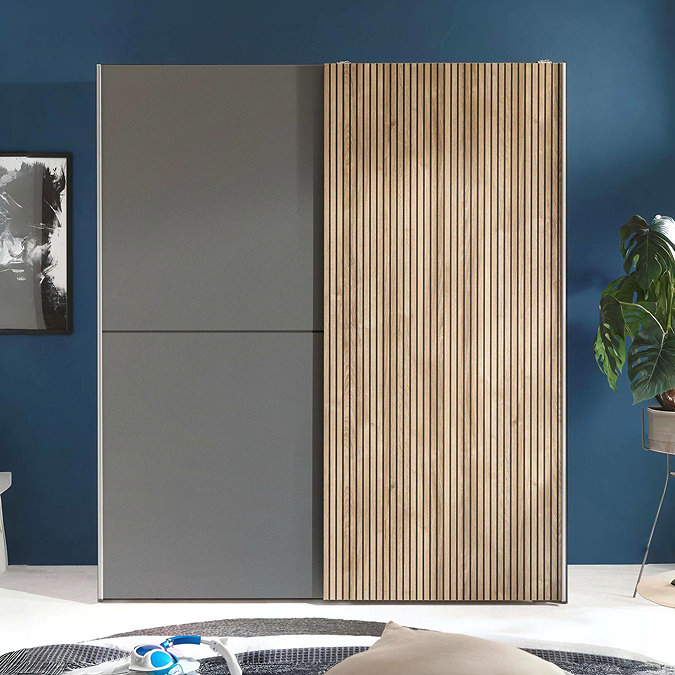 front on image of wide wardrobe with sliding doors - one grey and the other with thin wood-panel front