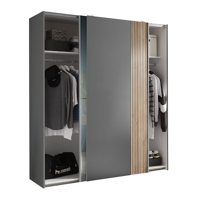 image cut out on white background of wide grey wardrobe with sliding doors meeting in the middle