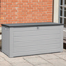 image of extra large grey plastic storage box outside in front of red brick wall