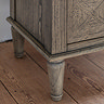 close up image of elegant wood feet of bedside table