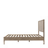 side on image of slatted solid wood bedframe without mattress on it
