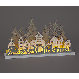 Wooden Christmas letter decoration with sleigh, houses and glittery trees, lit up from behind by warm white LED.