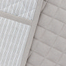 close up image of soft grey stripe pattern of double oven glove