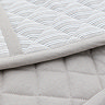close up image of soft grey stripe oven glove, highlighting quilted texture