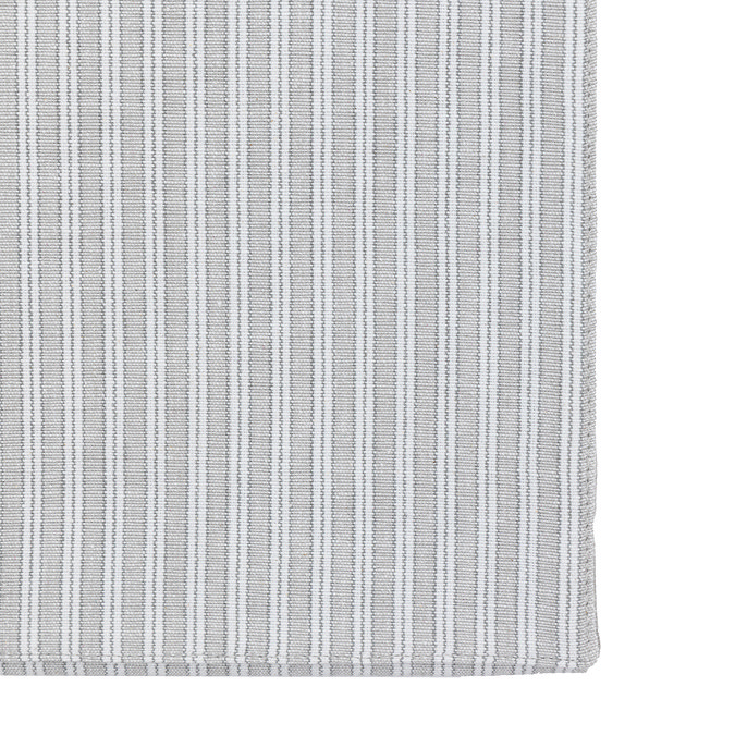 close up image cut out on white background of grey stripe table runner corner