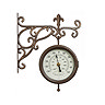 image cut out on white background of brown station clock with intricate ivy-style arm and round face with arabic numbers