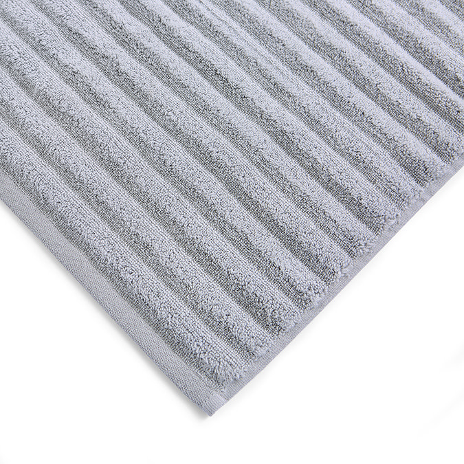 close up image of texture and colour of ribbed silver-grey towels